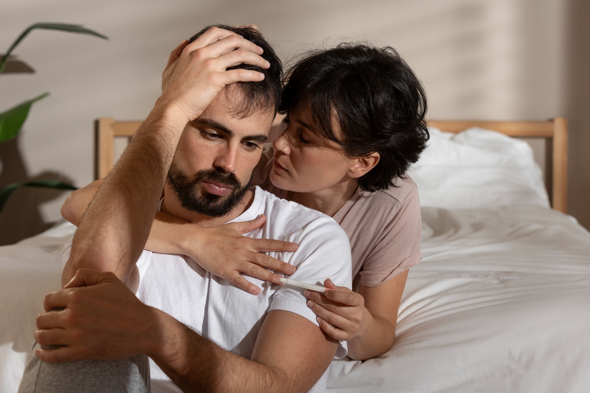 A couple experiencing emotional distress, reflecting challenges in their intimate relationship, and how intimacy issues can affect emotional well-being.