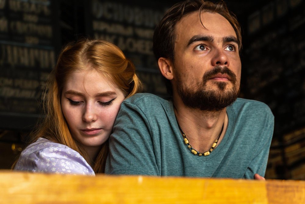 Couple hugging while staring into the distance, evoking themes of healing, trust rebuilding after betrayal, and moving forward together.